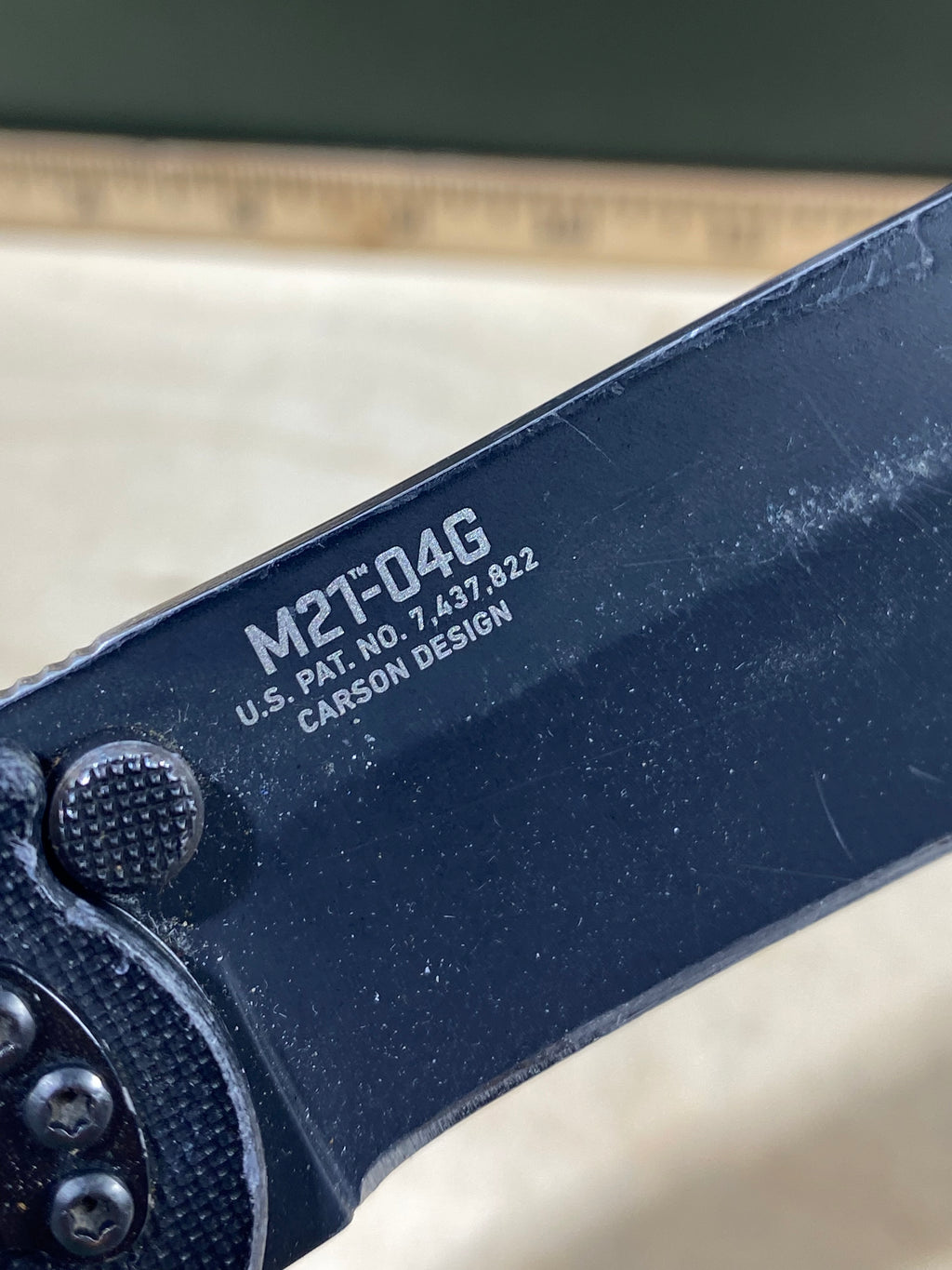 CRKT M21-04G Spear Point #141. Light usage. Resharpened