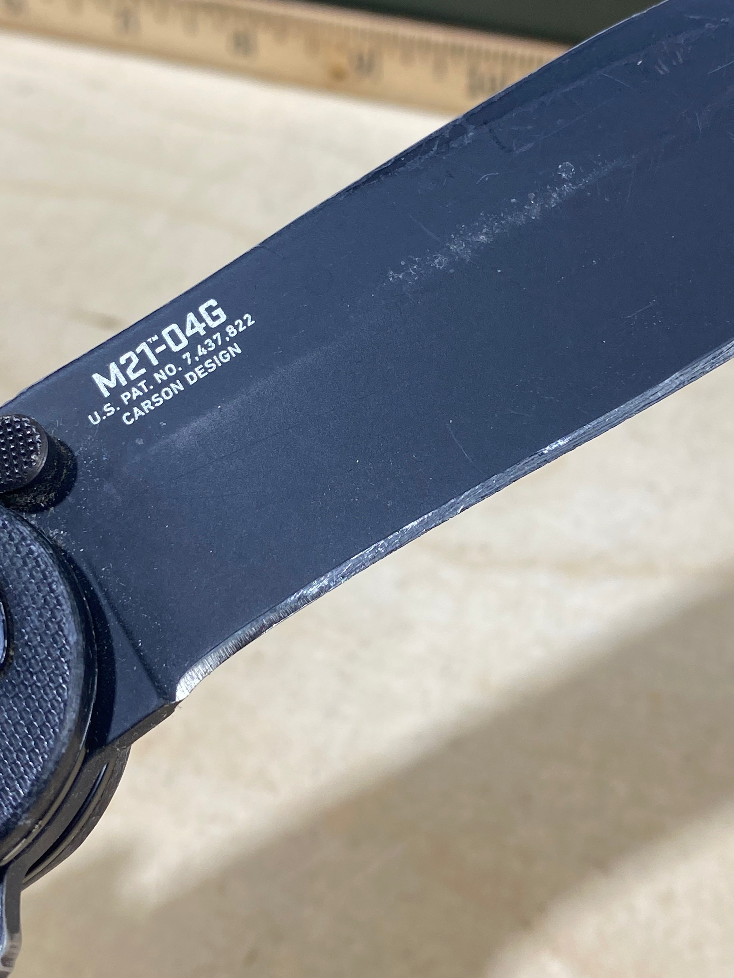 CRKT M21-04G Spear Point #141. Light usage. Resharpened