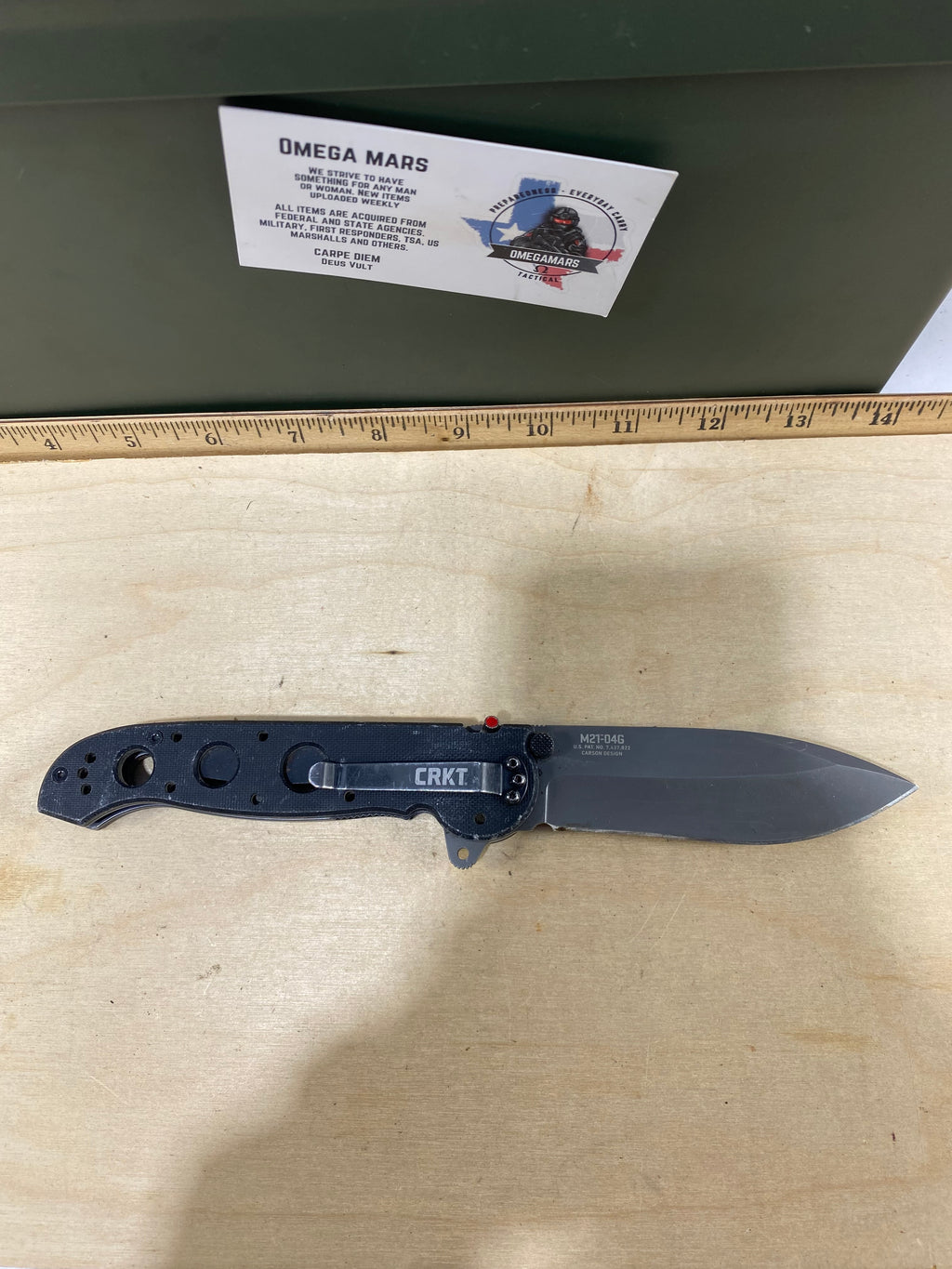 CRKT M21-04G Spear Point #145. Light usage. Resharpened