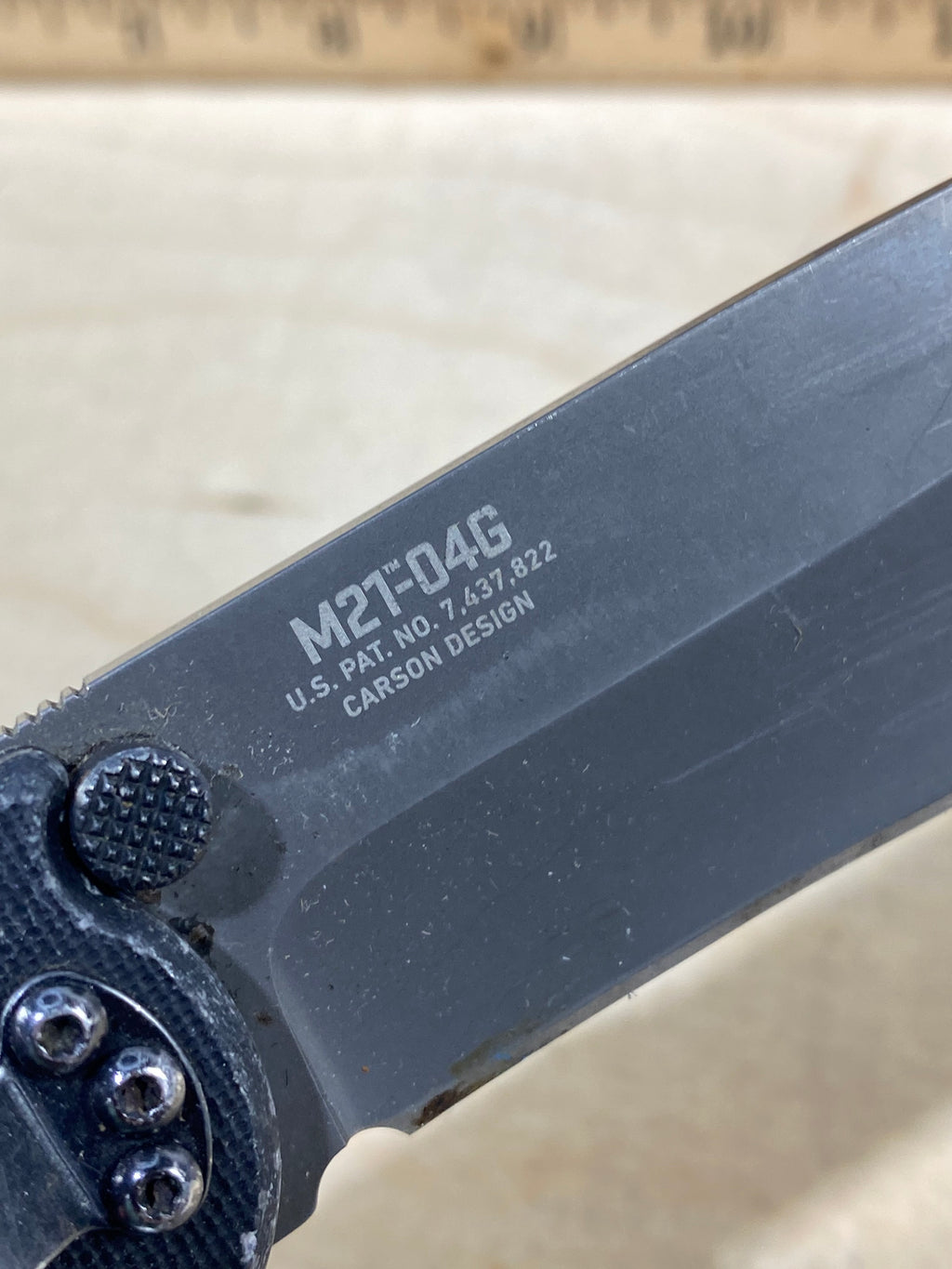 CRKT M21-04G Spear Point #145. Light usage. Resharpened