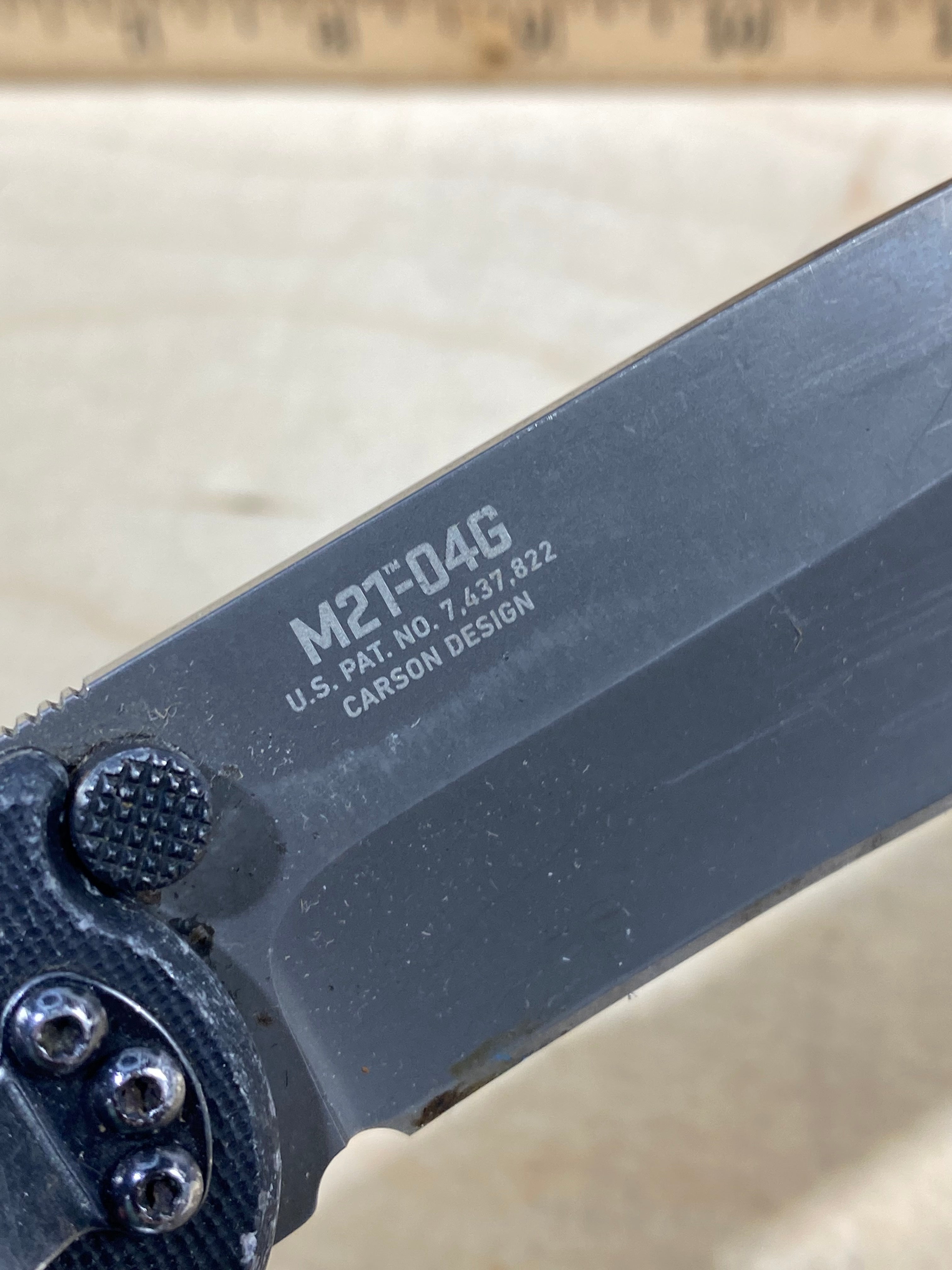 CRKT M21-04G Spear Point #145. Light usage. Resharpened