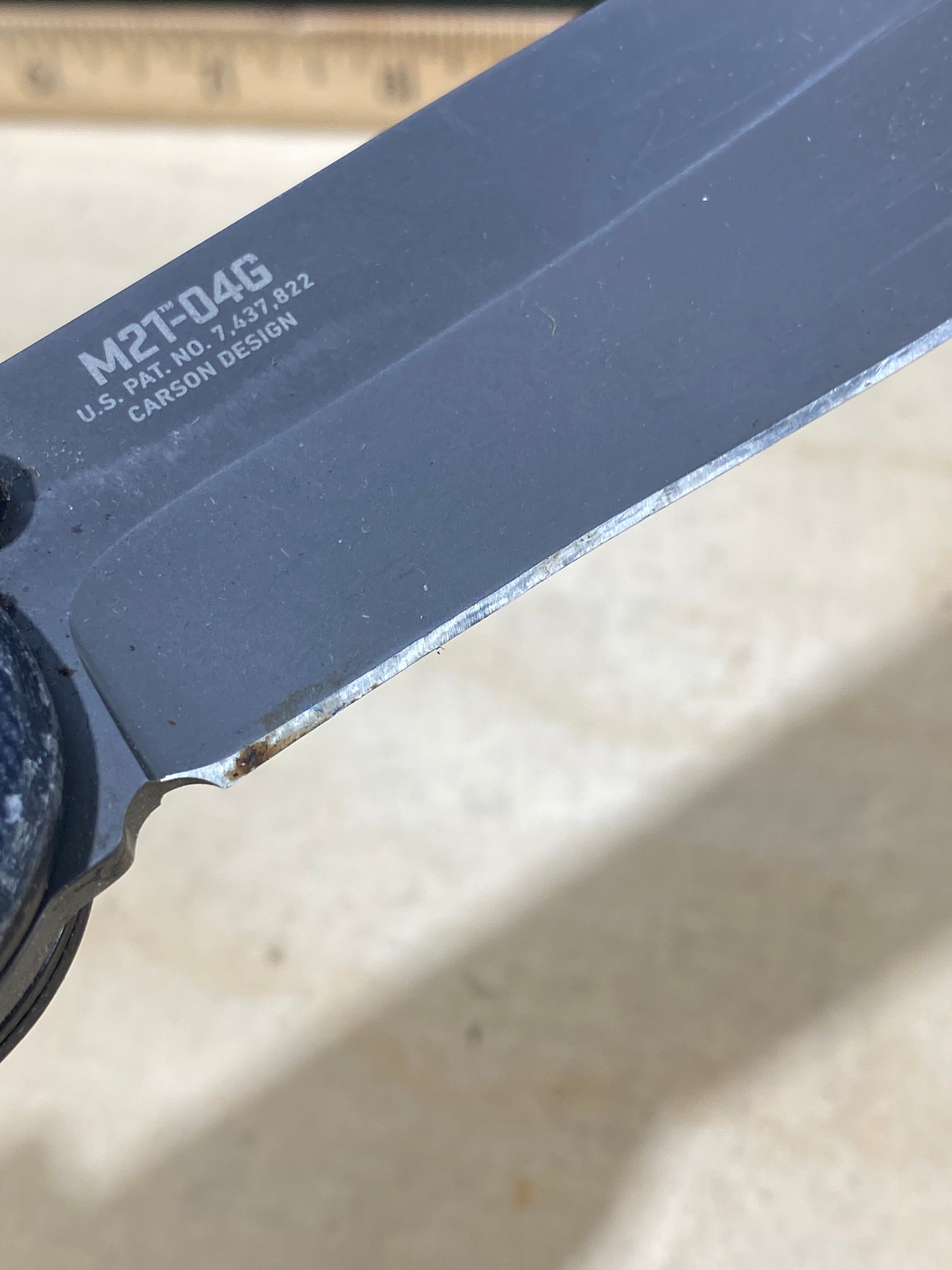 CRKT M21-04G Spear Point #145. Light usage. Resharpened
