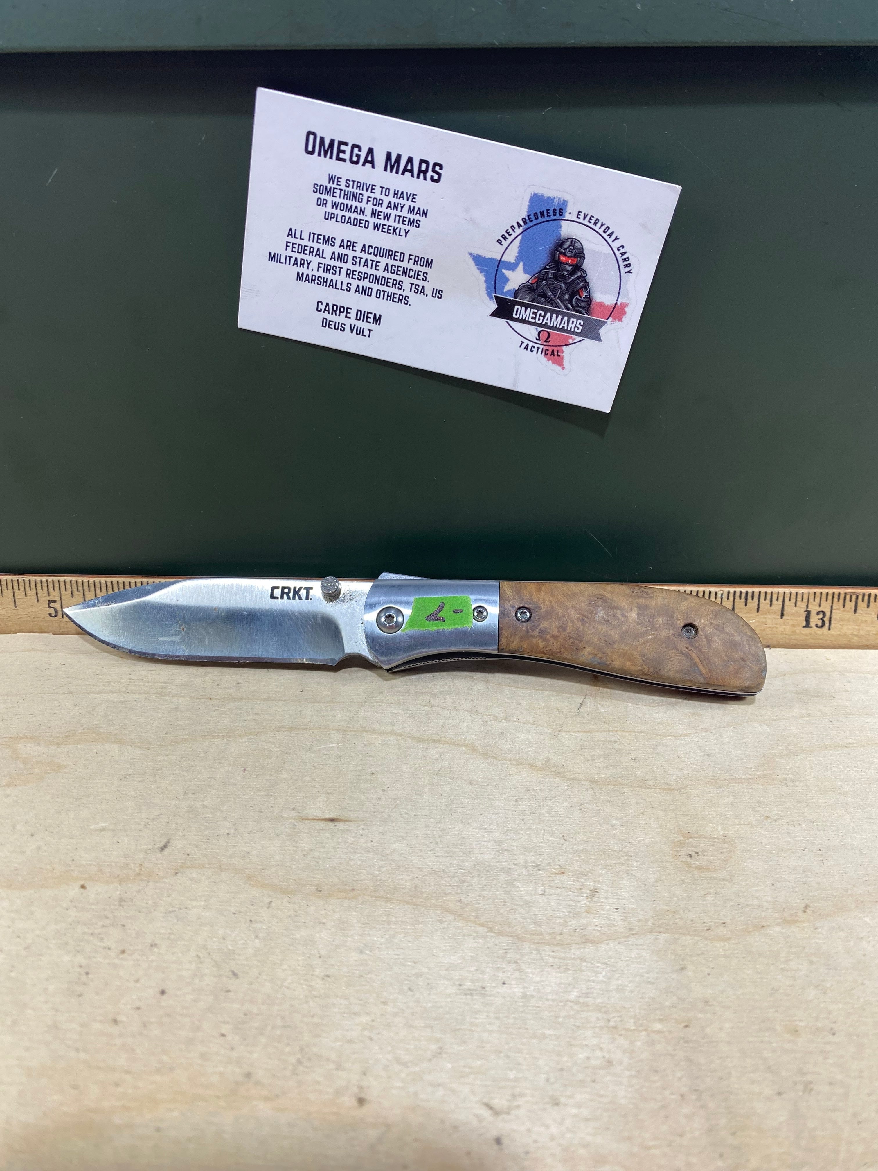CRKT M4-02W #-7. Light usage. Dirty. Chip on blade. Discontinued.