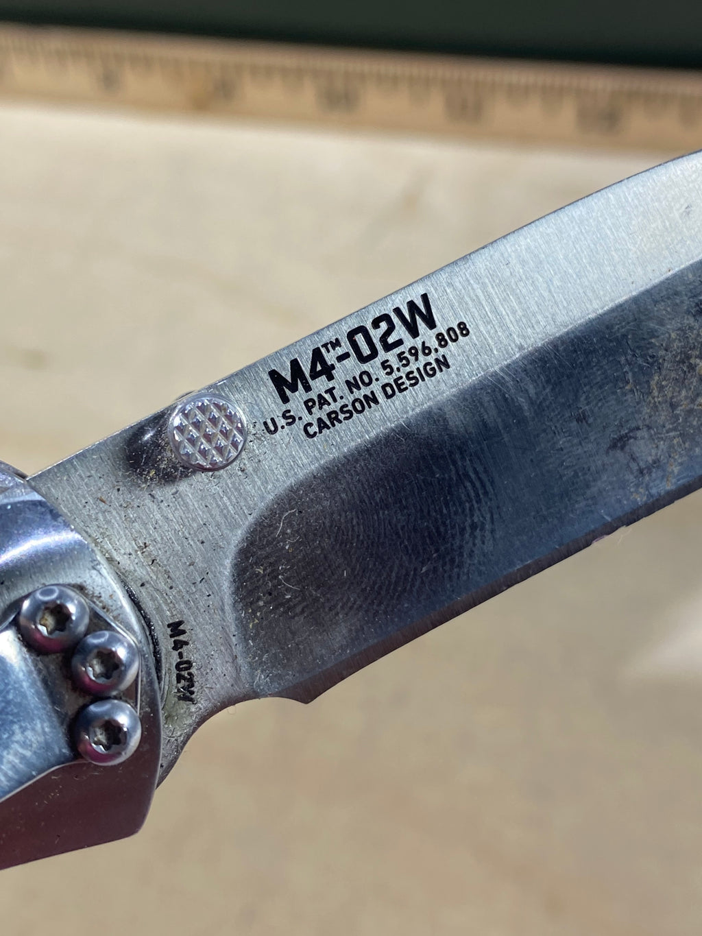 CRKT M4-02W #-7. Light usage. Dirty. Chip on blade. Discontinued.