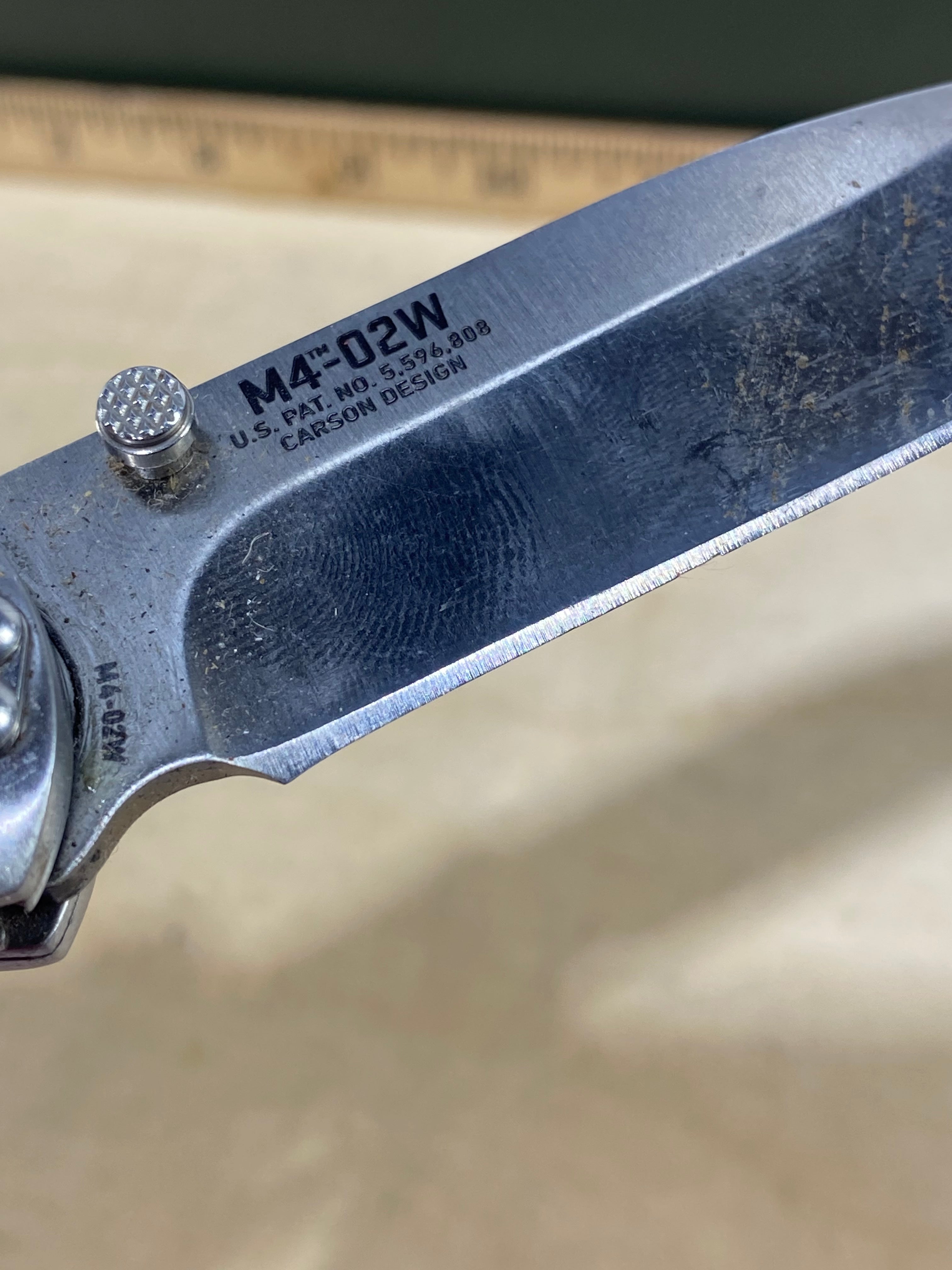 CRKT M4-02W #-7. Light usage. Dirty. Chip on blade. Discontinued.