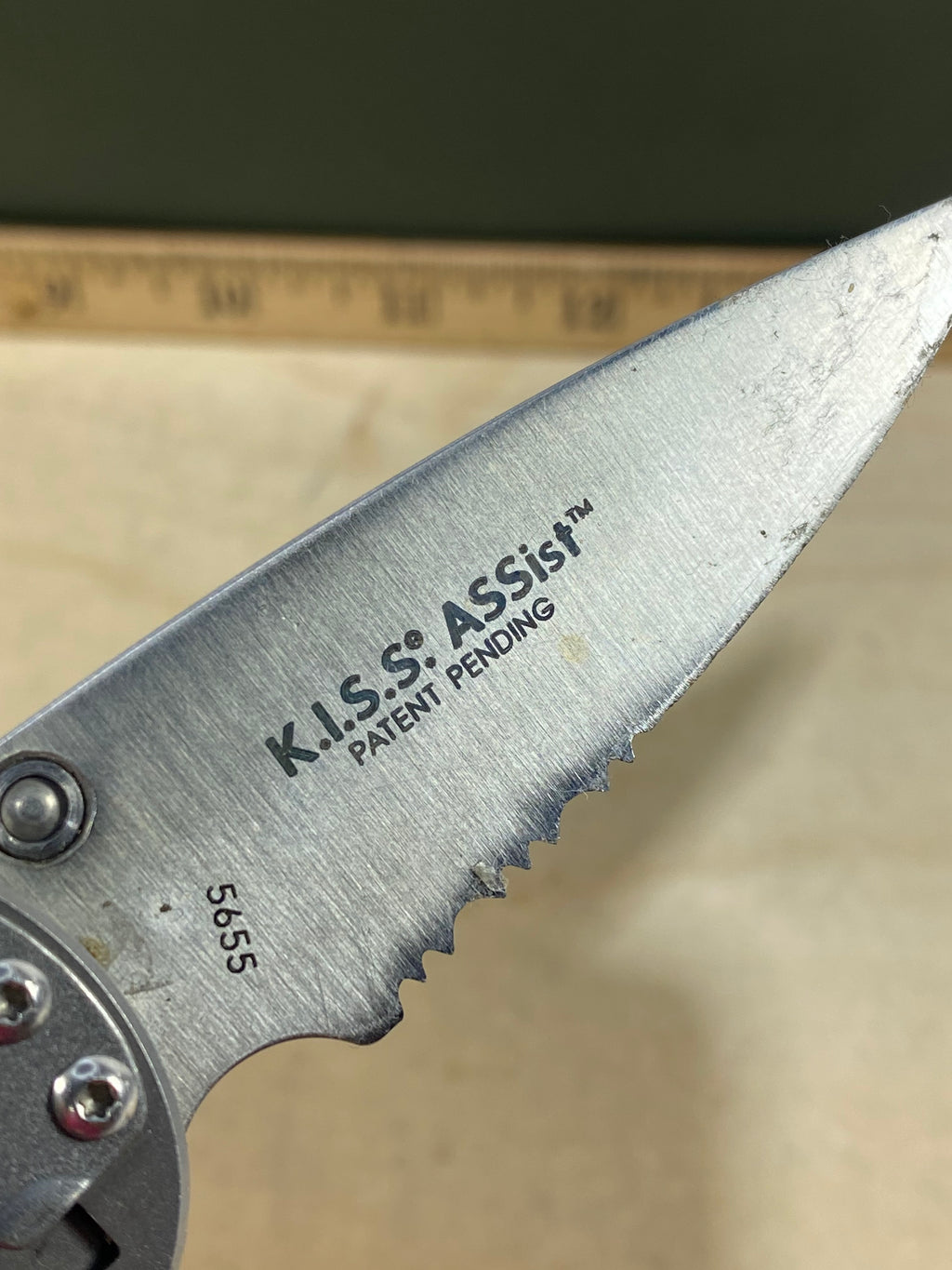 CRKT  5655 Kiss #-55. Light usage. Chips on blade. Dirty. Resharpened. Discontinued.