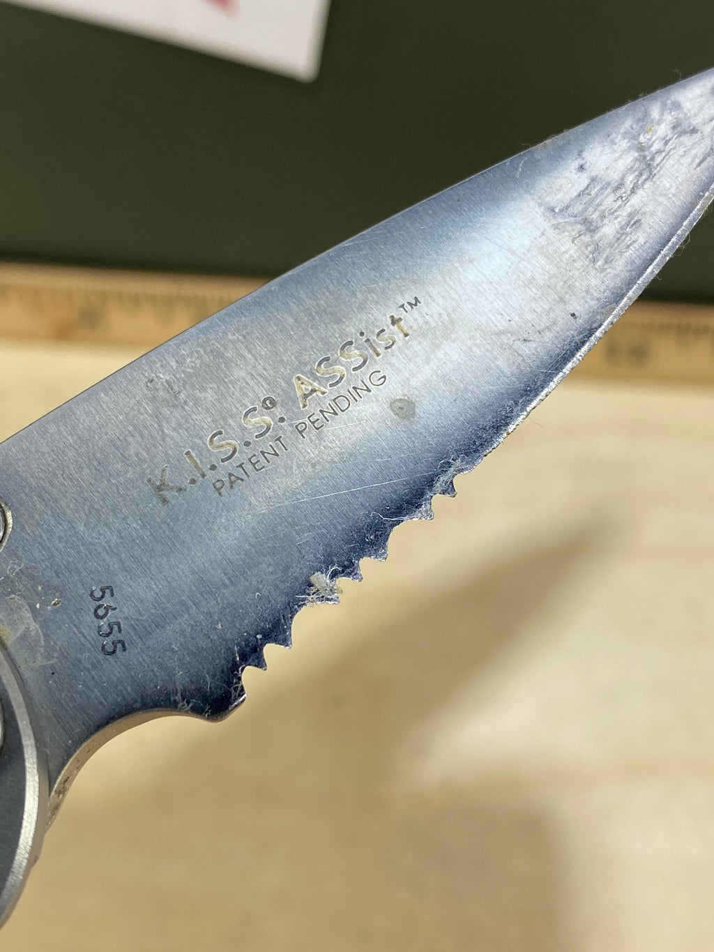 CRKT  5655 Kiss #-55. Light usage. Chips on blade. Dirty. Resharpened. Discontinued.