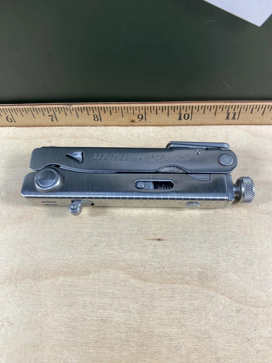 Leatherman Crunch with leather sheath LCH#1. Light usage, dirty. Discontinued